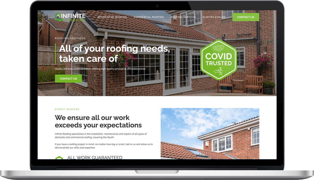 roofing website designer on laptop